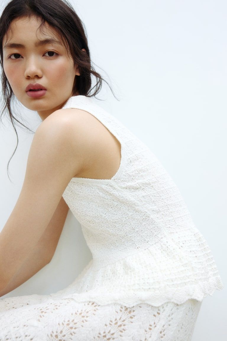 Pointelle-knit peplum top